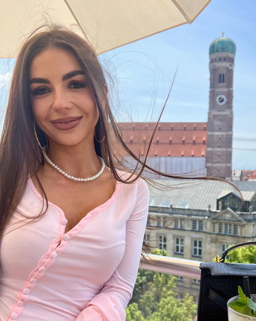 Liliia on a rooftop in Munich, the Frauenkirche behind her